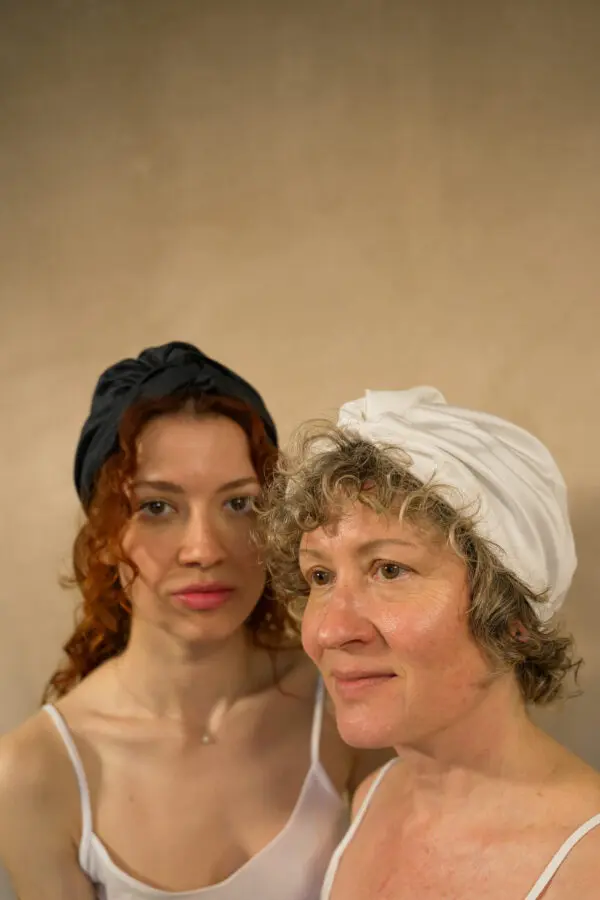 2 females wearing the 100% bamboo hair bonnet