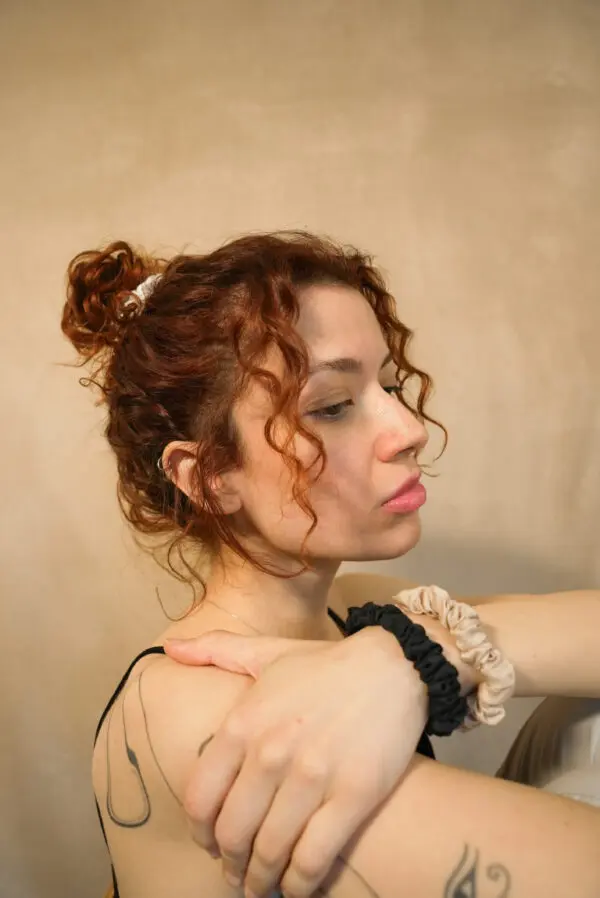 Woman with 100% bamboo scrunchies around her wrist