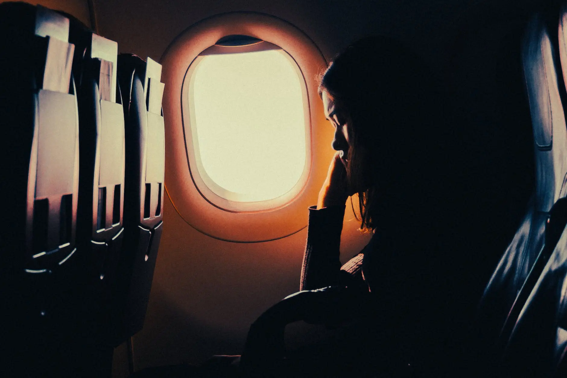 Woman with curls in airplane